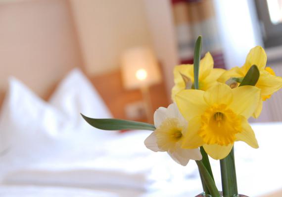 Flowers & fresh bed sheets at Hotel Römerrast near Caldaro